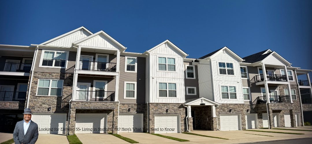 A modern apartment building with three stories, featuring balconies and garages, under a clear blue sky. A person in a suit and hat is standing in the foreground. Text at the bottom reads, "Looking for Elevated 55+ Living in Stafford, Virginia? Here's What You Need to Know."