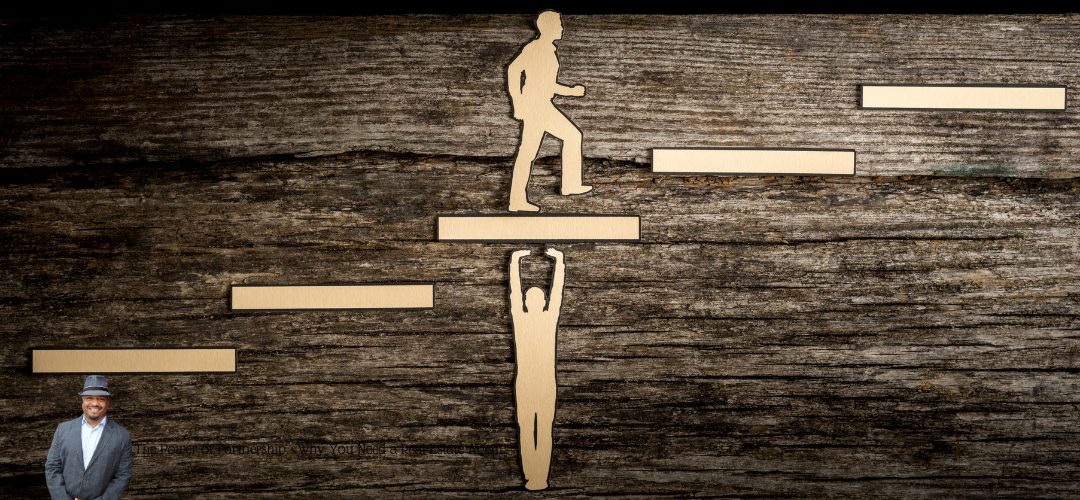 A wooden background with cut-out silhouettes of two people on different steps of a ladder. One figure climbs upward, while the other hangs from a lower step. In the bottom left corner, a man in a suit and hat is visible. Text overlay reads: "The Power of Partnership - Why You Need a Real Estate Agent."